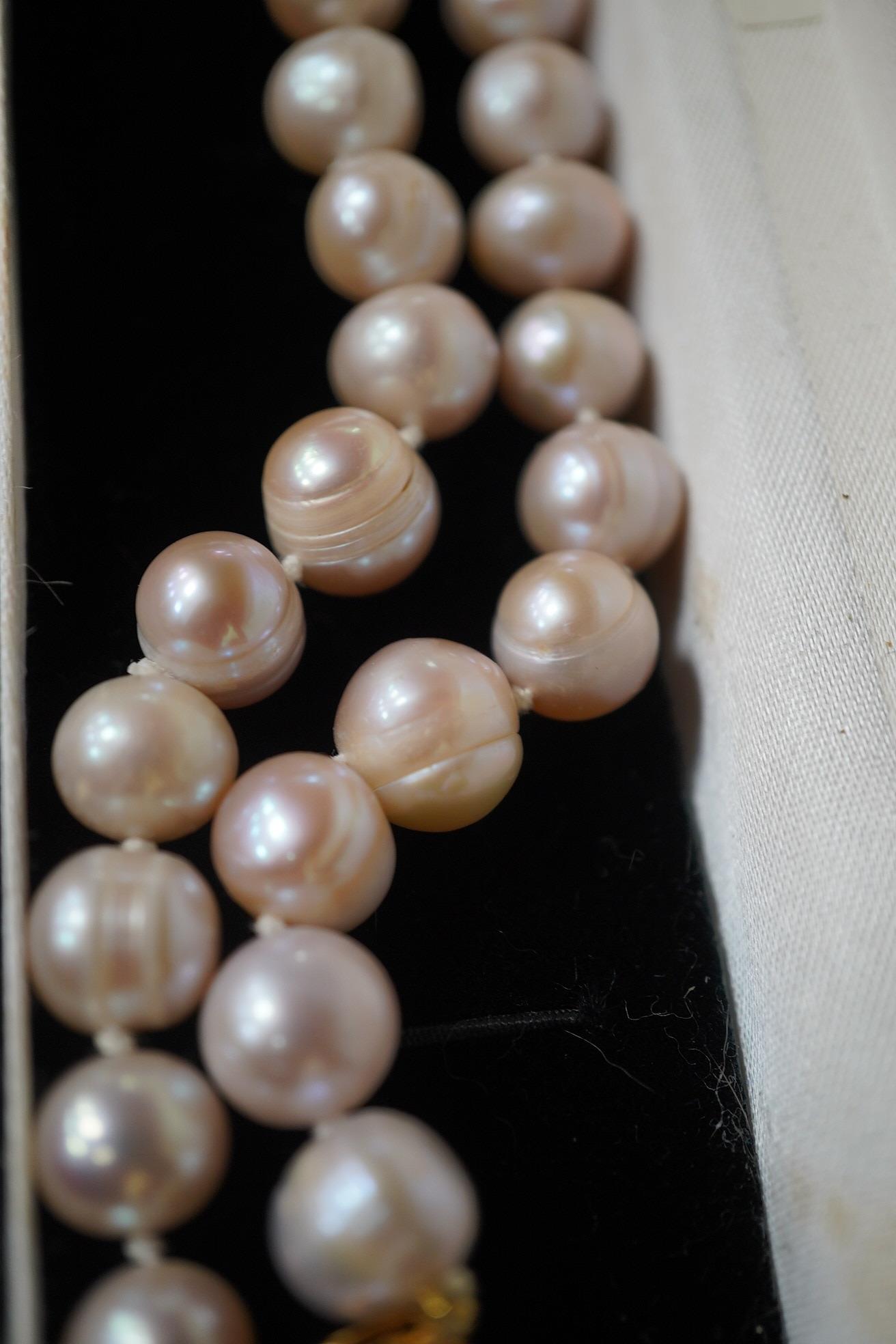 A modern single strand cultured pearl necklace, with cultured pearl cluster set 9ct clasp. Condition - fair to good